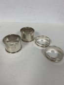 Two pairs of silver napkin rings, including 1921, Edinburgh, maker HT., and two marked Webster,