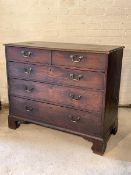 A George III stained oak country chest, the rectangular moulded top over two short and three long