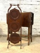 An Edwardian mahogany drop leaf Sutherland table, with slatted ends, raised on square splayed