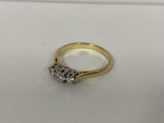 A gold engagement ring, markings rubbed, set diamonds (Q)