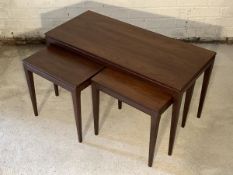 A Vintage mid century teak nest of three tables, each raised on square tapered supports H44cm,