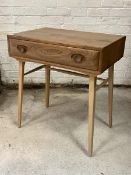 Ercol - A blonde elm side table, fitted with single drawer, raised on turned splayed supports W76cm,