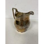 An 1806 London silver milk jug, makers mark TH., with Neoclassical decoration and having the initial