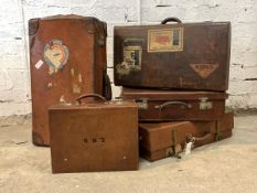 A collection of six early 20th century leather suitcases, largest H41cm, W72cm, D18cm