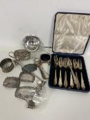 A mixed lot of silver and Epns including a Birmingham silver tea strainer, a silver mustard pot (