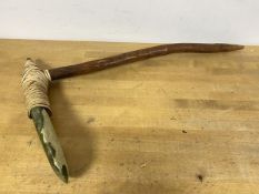 A Papua New Guinea adze with flat green stone blade, fibre binding on wooden handle (48cm x 29cm)