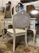 A white painted dressing table, the top with triptych swing mirror and trinket drawer over base