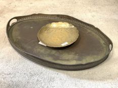 An oval metal drinks tray with raised pierced edge and handles to sides (61 x 40cm) and a brass dish