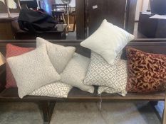 A collection of nine various scatter cushions