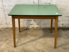 A mid century vintage table, with green formica top raised on splayed beech supports H76cm, W92cm,