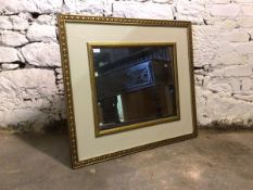 A cream and gilt painted rectangular wall hanging mirror, 84cm x 94cm