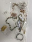 A quantity of costume jewellery including silver chains, paste stone bracelets, necklaces, some with