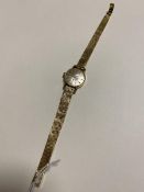 A Tissot lady's wristwatch, the chain link strap marked 750 (17cm)