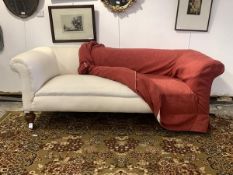 A Victorian three seat chesterfield sofa, overstuffed and sprung seat, with loose fitted red
