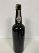 A bottle of port, lacking body labels, neck labels reading IVP to one side, the other with Vinho