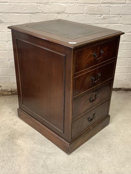 A reproduction mahogany hanging filling cabinet, with inset tooled writing surface over two drawers,