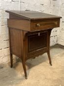 An Edwardian inlaid writing desk, the top fitted with stationary box, lifting and inset with