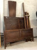 A Traditional mahogany 5'6" double bed, with panelled head and footboard on stile supports H125cm,