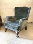 Parker Knoll - A rare mid 20th century wingback armchair, upholstered in blue velvet, with squab