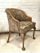 A Queen Anne style walnut framed bedroom chair, upholstered in floral tapestry type fabric, raised