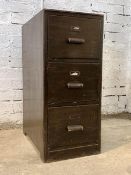 A circa 1940's stained oak three drawer filing cabinet, each drawer with divisions, raised on a