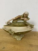 A Royal Dux porcelain figural pedestal bowl, the oval bowl surmounted by figure of Boy with