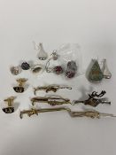 A mixed lot of silver and costume jewellery including pendants, earrings, cufflinks, five sporting