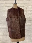 A Lady's dyed squirrel gilet with satinized lining, L58cm (from shoulder) across hem 106cm, across
