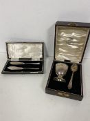 A Hamilton & Inches 1933 Birmingham silver egg cup, inscribed From Uncle Norman and spoon, in
