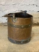 A 19th century riveted copper and brass bound cylindrical bucket, D33cm