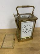 An Edwardian repeating carriage alarm clock, the top with oval glass with four glass sides, the dial