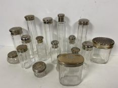 A collection of toiletry bottles, some with silver lids (tallest: 19cm) (17)