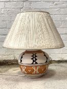 A Contemporary white black and terracotta painted ceramic table lamp of baluster form, together with