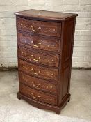 A late 20th century Anglo-Indian style hardwood bow front chest, having floral carving and brass