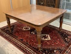 A Victorian oak wind out extending dining table, the rectangular top with rounded corners raised