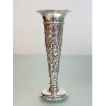 An Edwardian silver bud vase, William Comyns, London 1902, of trumpet form, chased with iris and