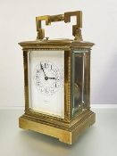 A brass repeating alarm carriage clock, early 20th century, the eight day twin-train movement with