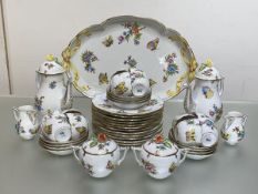 An extensive Herend "Queen Victoria" porcelain coffee service, decorated with butterflies and floral