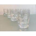 A set of six "Safari" engraved glass whisky tumblers, probably Rowland Ward, each with a differing