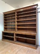 A large mahogany library open bookcase, c. 1900, the cavetto cornice over ten adjustable shelves,