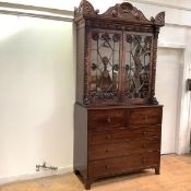 A mahogany secretaire bookcase, early 19th century, the top in the manner of William Trotter,