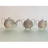 An Indian three piece silver tea service, late 19th century, possibly Oomersi Mawji, (Kutch) but