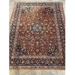 A hand-knotted North-West Persian rug, the deep orange field with orange medallion, with