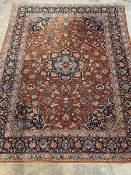 A hand-knotted North-West Persian rug, the deep orange field with orange medallion, with
