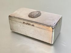 A silver cigarette box with military presentation plaque and inscription, A. & J. Zimmerman,