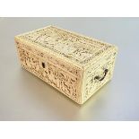 A fine Chinese Export carved ivory box, Canton, c. 1800, the rectangular box with hinged cover