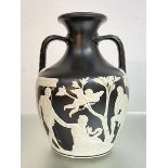 A 19th Century Wedgwood Parian, black dipped Portland Vase sprigged in characteristic manner with