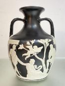 A 19th Century Wedgwood Parian, black dipped Portland Vase sprigged in characteristic manner with