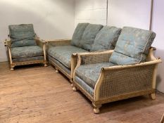 A cream and gilt-painted three piece bergere suite, 1920's, comprising a three-seat sofa, with
