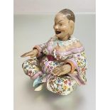 A Naples porcelain "pagoda" nodding head figure, late 19th century, with moving tongue and hands, in